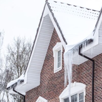 Icicles forming from the rain spouts.